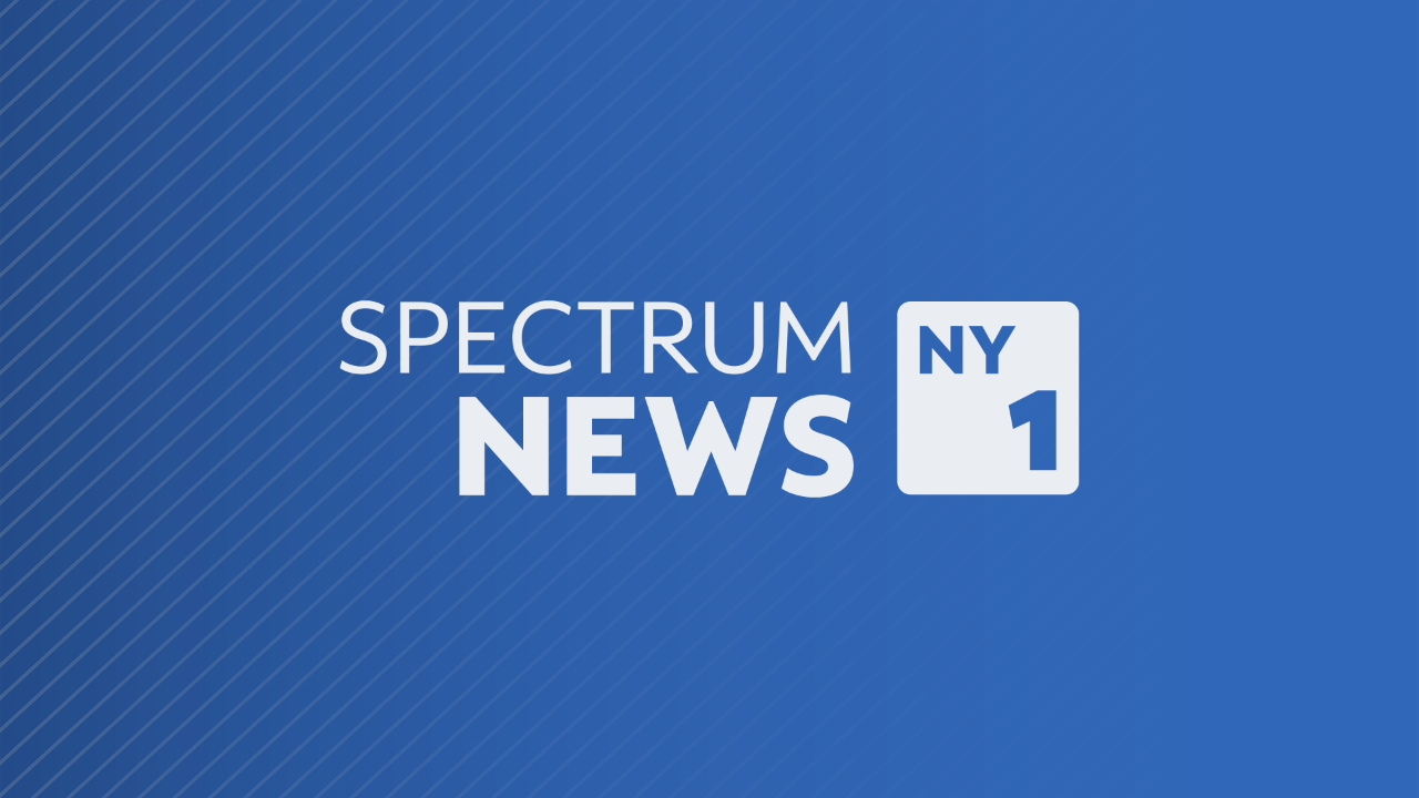 Spectrum News NY1 logo in white against a solid blue background.