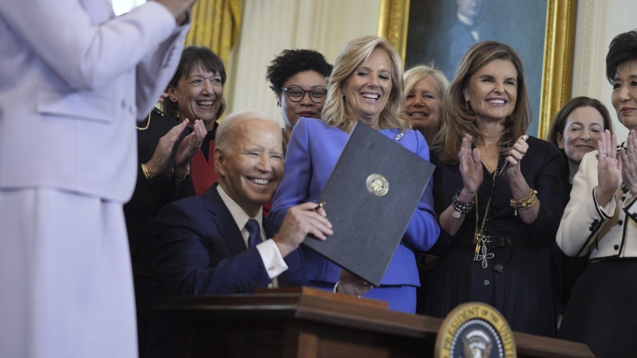 President Joe Biden smiles after signing an executive order on women's health, during a Women's History Month event in the East Room of the White House, Monday, March 18, 2024, in Washington. (AP Photo/Evan Vucci)