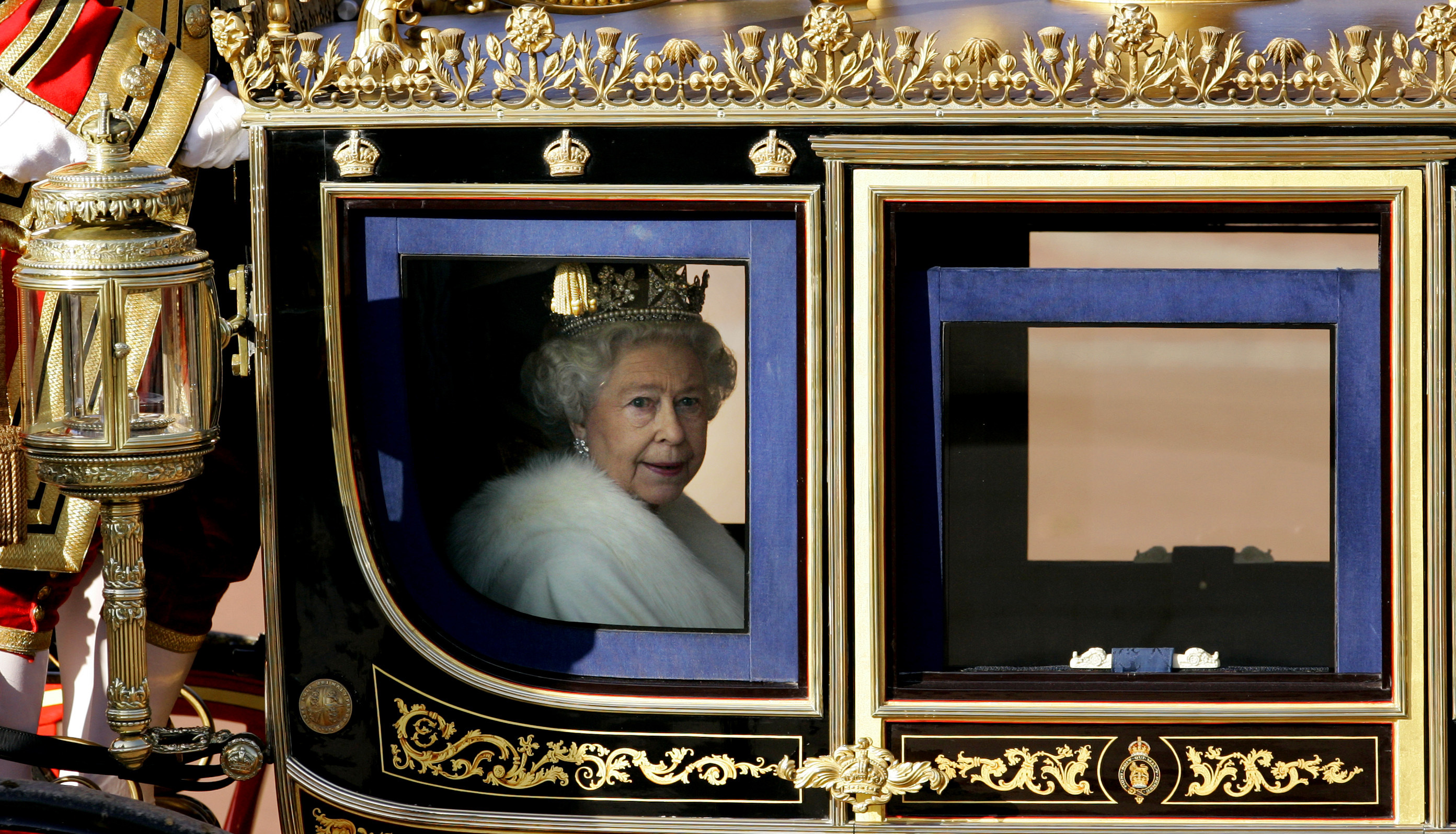 Britain's Queen Elizabeth II leaves Buckingham Palace in a carriage to attend the State opening of Parliament in London, Nov. 6, 2007. (AP Photo/Kirsty Wigglesworth)